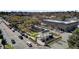 Aerial view of a charming downtown area with brick buildings and tree-lined streets, and a town square at 214 E Doty Ave, Summerville, SC 29483