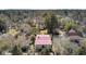 Birds eye view of house with a red roof surrounded by mature trees and neighborhood at 214 E Doty Ave, Summerville, SC 29483