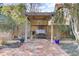 Cozy backyard patio with a brick walkway, grill, and outdoor seating under a pergola at 214 E Doty Ave, Summerville, SC 29483