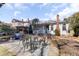 Cozy backyard with a brick patio and multiple seating areas, ideal for gatherings at 214 E Doty Ave, Summerville, SC 29483