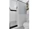Modern bathroom with white tiled shower, contrasting black accents, and sleek fixtures at 214 E Doty Ave, Summerville, SC 29483