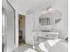 Bright bathroom with a vanity, tub and glass shower, offering a serene and functional space at 214 E Doty Ave, Summerville, SC 29483