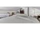 Bright bedroom features multiple beds, neutral decor, and an open floor plan at 214 E Doty Ave, Summerville, SC 29483