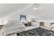 Spacious bedroom featuring multiple beds, ceiling fan, and unique attic architecture at 214 E Doty Ave, Summerville, SC 29483
