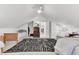 Comfortable attic bedroom with ample space, three beds, and lots of natural light at 214 E Doty Ave, Summerville, SC 29483