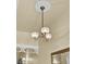 Foyer chandelier with decorative ceiling medallion and ornate detailing at 214 E Doty Ave, Summerville, SC 29483