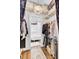 Walk in closet with built-in shelving and an attached bathroom with a tub at 214 E Doty Ave, Summerville, SC 29483
