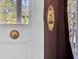 Close-up of a classic wood front door showcasing vintage brass door hardware at 214 E Doty Ave, Summerville, SC 29483