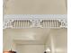 Close-up detail of the decorative trim above the staircase, adding architectural interest to the foyer at 214 E Doty Ave, Summerville, SC 29483