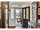 Welcoming foyer features hardwood floors, an antique cabinet, and natural light at 214 E Doty Ave, Summerville, SC 29483
