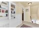 Bright hallway with built-in shelving and classic wainscoting detail at 214 E Doty Ave, Summerville, SC 29483