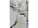 Efficient laundry room with washer, dryer, storage shelves and cleaning supplies at 214 E Doty Ave, Summerville, SC 29483