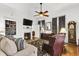 Cozy living room with hardwood floors, fireplace, built-in shelves, and a comfortable seating arrangement at 214 E Doty Ave, Summerville, SC 29483