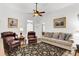 Spacious living room featuring hardwood floors, comfortable seating, and ample natural light, creating a welcoming space at 214 E Doty Ave, Summerville, SC 29483