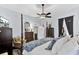 Spacious bedroom features hardwood floors, a four-poster bed, and a sitting area at 214 E Doty Ave, Summerville, SC 29483