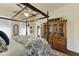 Bedroom with a four poster bed, hardwood floors, and a wooden bookcase at 214 E Doty Ave, Summerville, SC 29483