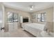 Serene bedroom featuring two windows, a comfortable bed, and a dresser with a built-in television at 214 Sea Cloud Cir, Edisto Island, SC 29438