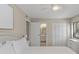 Cozy bedroom featuring a closet, a window for natural light, and a door leading to the bathroom at 214 Sea Cloud Cir, Edisto Island, SC 29438