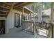 Outdoor wooden deck of home with upper and lower level views of the green backyard at 214 Sea Cloud Cir, Edisto Island, SC 29438