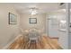 Bright dining area with a round wooden table and four white chairs, perfect for Gathering meals at 214 Sea Cloud Cir, Edisto Island, SC 29438