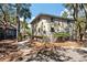 Side view of condo with a wooden walkway and lush surroundings at 214 Sea Cloud Cir, Edisto Island, SC 29438