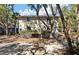 Condo building exterior with a view of private balconies, trees, and shaded parking at 214 Sea Cloud Cir, Edisto Island, SC 29438