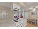 Open kitchen with a view of the living room and dining area, complete with essential appliances and ample counter space at 214 Sea Cloud Cir, Edisto Island, SC 29438