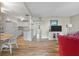 Cozy living area with a full kitchen, dining set, hardwood floors and bright neutral walls at 214 Sea Cloud Cir, Edisto Island, SC 29438