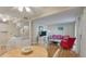 Inviting living room with a dining table and four chairs, hardwood floors, and a comfortable sofa and chair at 214 Sea Cloud Cir, Edisto Island, SC 29438