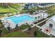 Aerial view of a community pool area featuring a large pool, sun loungers, and well-manicured landscaping at 220 Garden Gate Way, Summerville, SC 29486