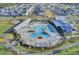 Aerial view showcasing the community's resort-style pool, amenity center, and residential homes at 220 Garden Gate Way, Summerville, SC 29486