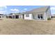 This home boasts a large backyard with a covered patio, creating an ideal outdoor space at 220 Garden Gate Way, Summerville, SC 29486