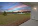 Back porch with a view of the landscaped backyard, waterway, and neighborhood beyond at 220 Garden Gate Way, Summerville, SC 29486