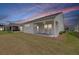 The backyard has a concrete patio and outdoor seating area for relaxing and entertaining at 220 Garden Gate Way, Summerville, SC 29486