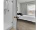View of bedroom through bathroom with tiled shower and window with blinds and curtains at 220 Garden Gate Way, Summerville, SC 29486