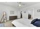 Well-lit bedroom with carpet flooring, ceiling fan, dresser and doorway to bathroom at 220 Garden Gate Way, Summerville, SC 29486