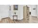 Entry foyer featuring hardwood floors, a coat closet, and decorative table with flowers at 220 Garden Gate Way, Summerville, SC 29486