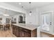 Kitchen island with granite countertops and dark wood cabinets offering an open design at 220 Garden Gate Way, Summerville, SC 29486