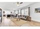 A view from the living room of the kitchen and dining area with hardwood flooring at 220 Garden Gate Way, Summerville, SC 29486