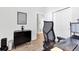 Modern home office with hardwood floors, natural light, and sleek black furniture at 220 Garden Gate Way, Summerville, SC 29486