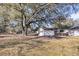 Spacious backyard with a white shed and mature tree at 2236 Pinehurst Ave, Charleston, SC 29414