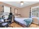 Comfortable bedroom with a full-sized bed, natural light, and a gaming setup at 2236 Pinehurst Ave, Charleston, SC 29414