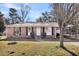 Charming single-story brick home featuring a white front door and manicured landscaping at 2236 Pinehurst Ave, Charleston, SC 29414