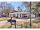 Brick home with car port, and a well-maintained front yard at 2236 Pinehurst Ave, Charleston, SC 29414