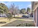 Well-maintained front yard featuring a lush lawn and mature trees in a desirable neighborhood at 2236 Pinehurst Ave, Charleston, SC 29414