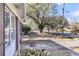 A view of the front yard, mature shade trees and a glimpse of the house at 2236 Pinehurst Ave, Charleston, SC 29414