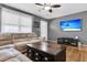 Comfortable living room with a large sectional sofa, hardwood floors, and a ceiling fan at 2236 Pinehurst Ave, Charleston, SC 29414