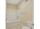 Bathroom featuring a white tub and shower combo with tiled walls and neutral tile flooring at 2244 Ashley Crossing Dr # 1236, Charleston, SC 29414