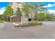 Well-maintained community entrance with lush landscaping and attractive signage at 2244 Ashley Crossing Dr # 1236, Charleston, SC 29414
