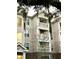 Stylish condo building featuring private balconies, complemented by classic architecture and lush Spanish moss at 2244 Ashley Crossing Dr # 1236, Charleston, SC 29414